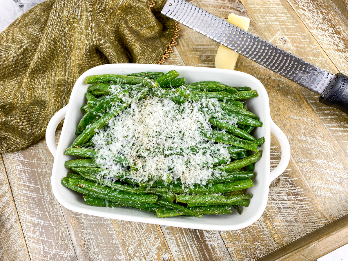parmesan green beans in white serving dish
