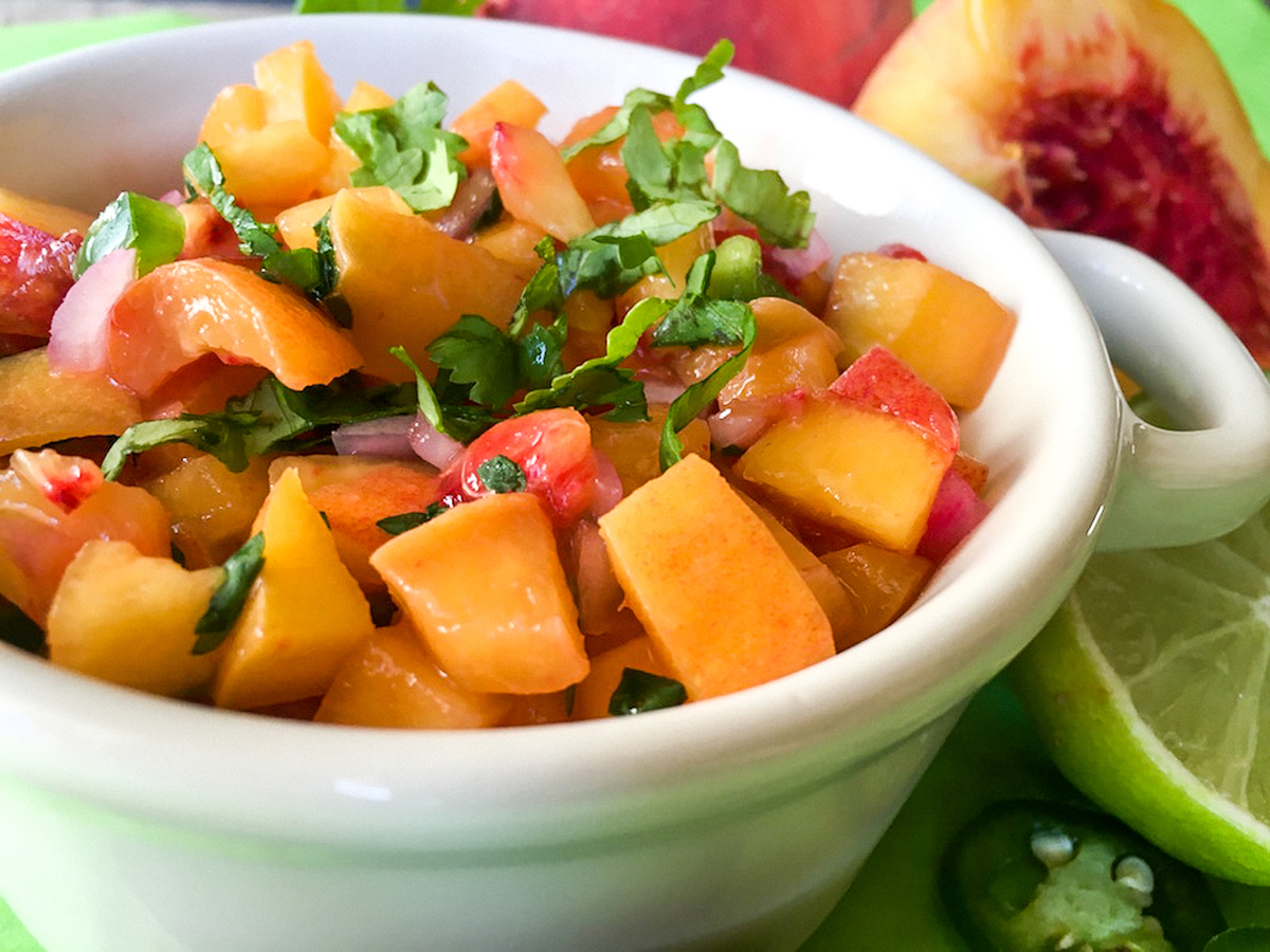 spicy peach salsa in white bowl