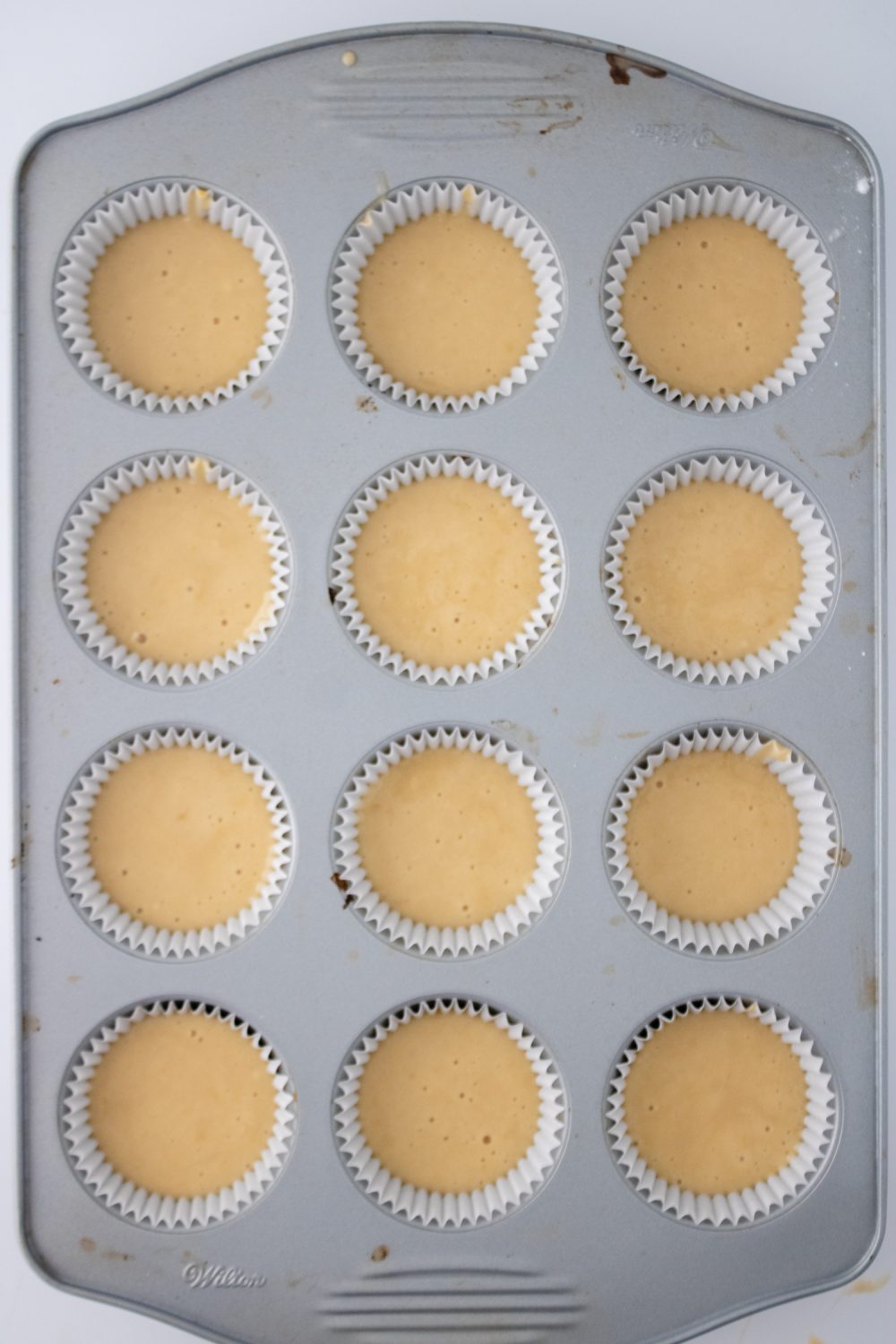 cupcake liners filled with butterbeer cupcake batter