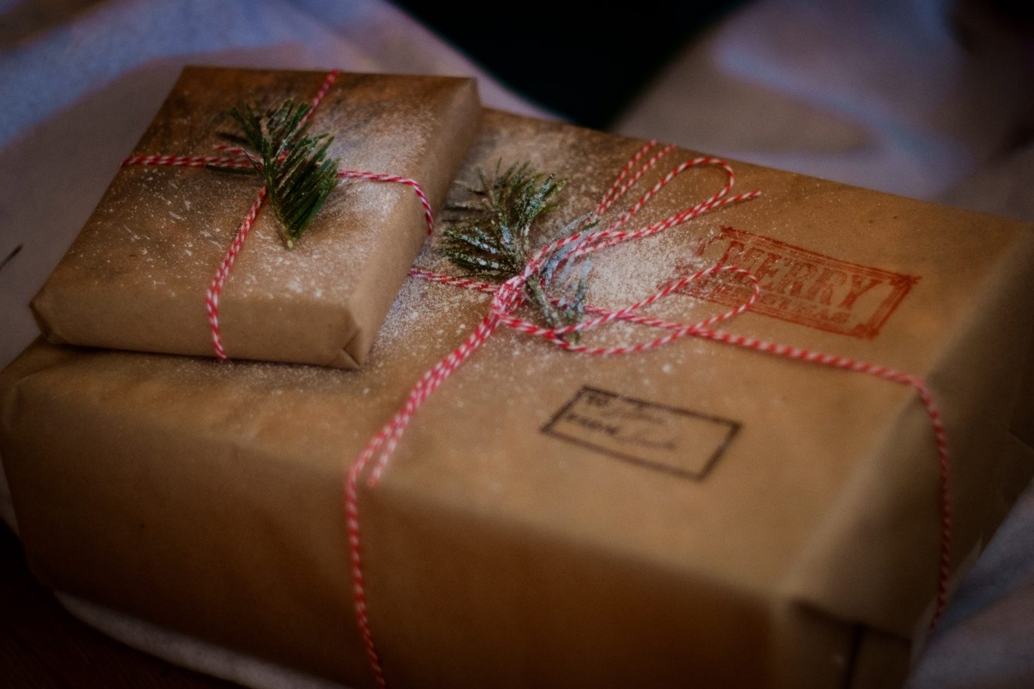 8 packages tied up with string traveling with gifts this holiday season