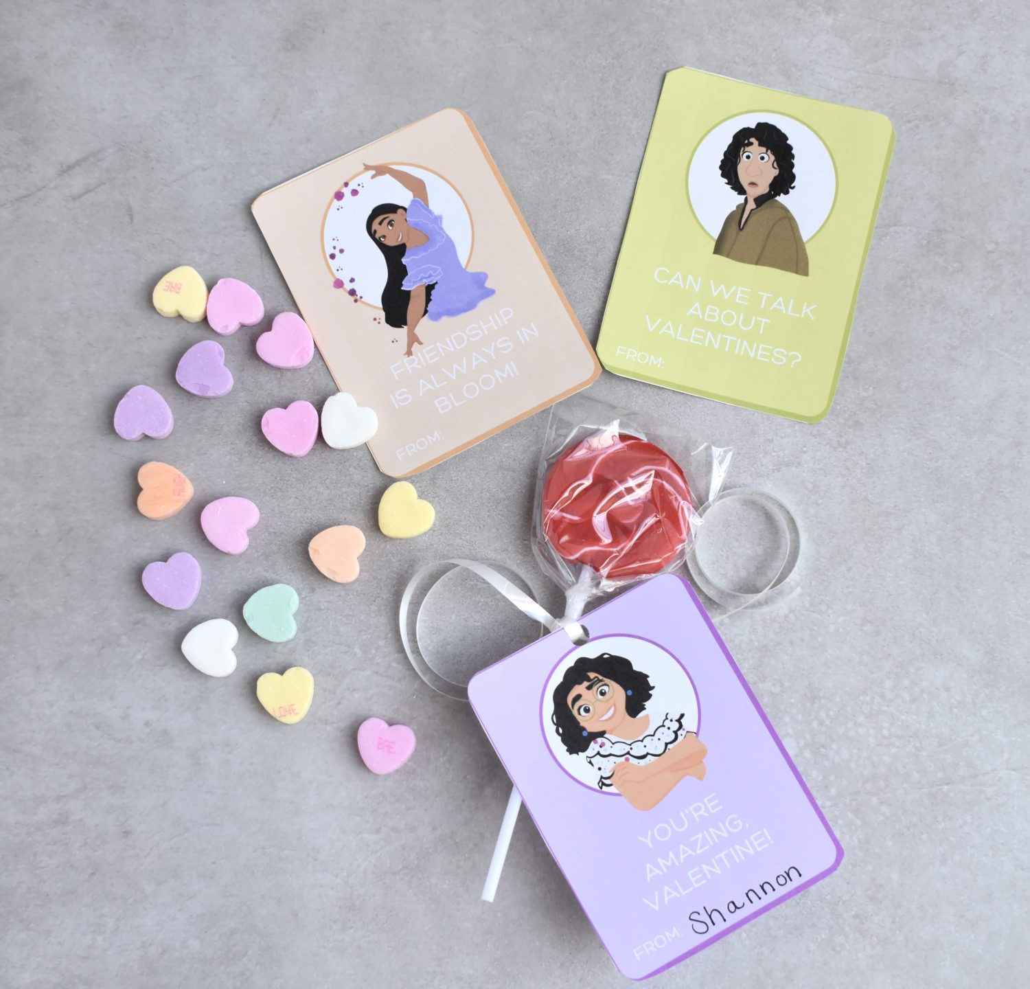 encanto valentines day cards flat lay with candy
